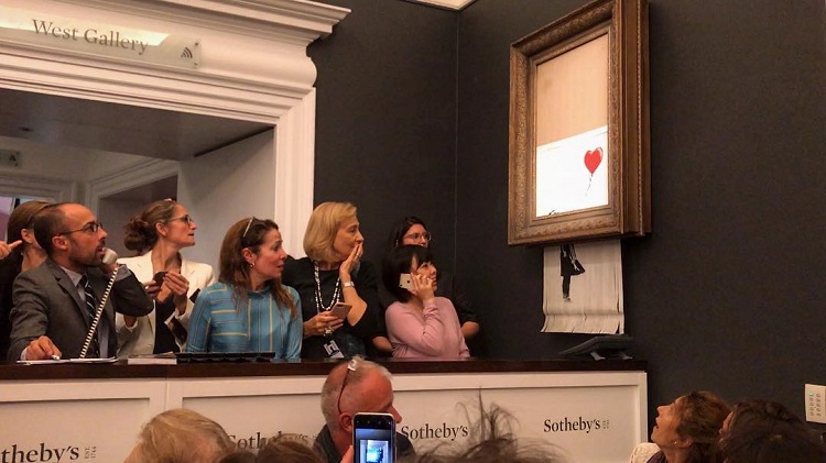 Obra de Banksy se autodestruye al ser vendida en 1 millón de dólares